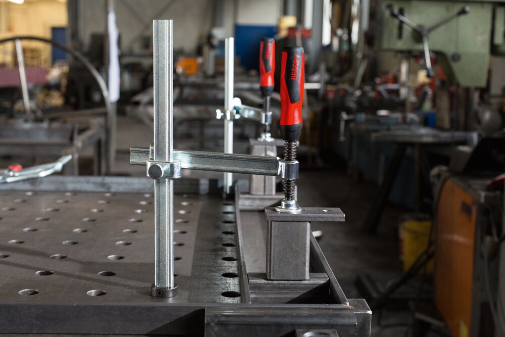Clamping elements for welding tables